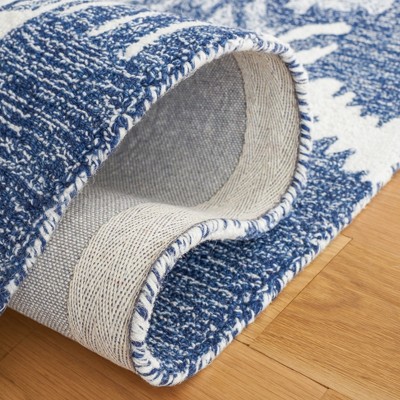 Handmade Blue and Ivory Tufted Wool Rectangular Rug