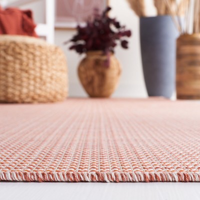 Beige and Terracotta Tufted Rectangular Synthetic Rug