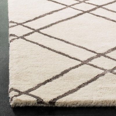 Hand-Tufted Artisan Square Wool Rug in Rich Brown