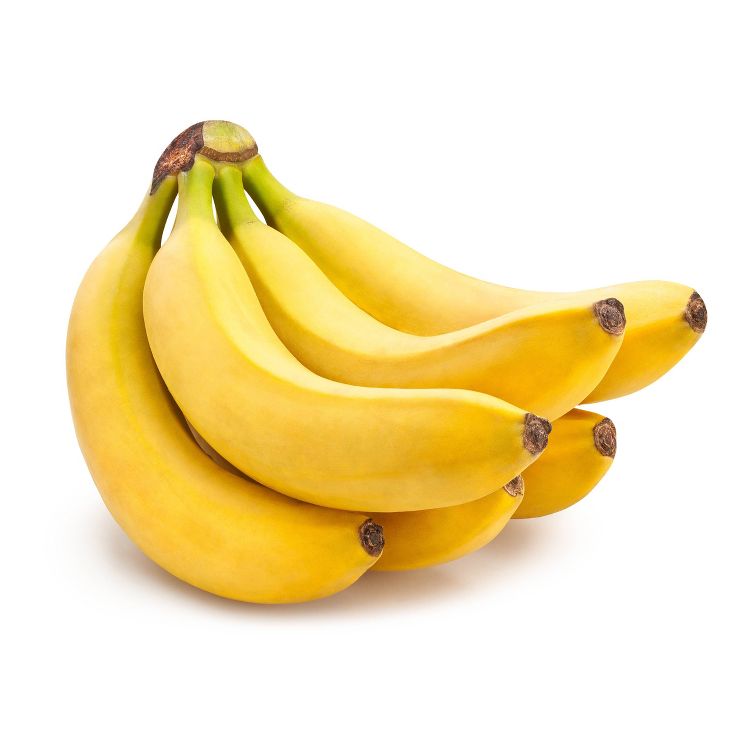 A bunch of ripe yellow colored bananas with green stems.
