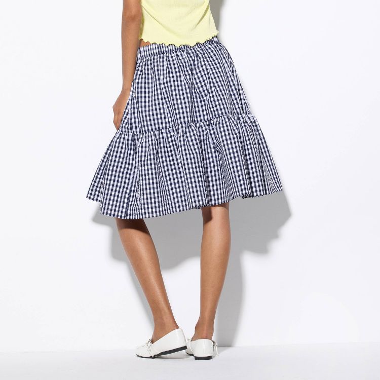 A knee-length skirt with a black and white checkered pattern.