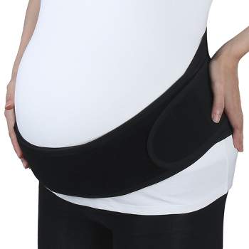 pregnant woman wearing maternity girdle. Isolated over white Stock