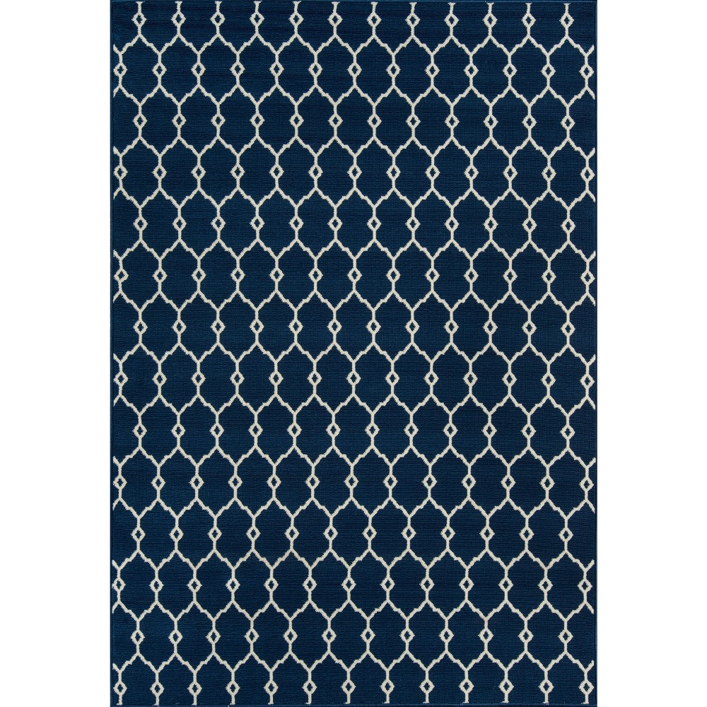 3'11 x5'7  Indoor/Outdoor Fretwork Accent Rug Navy - Momeni This elegant indoor/outdoor all-weather area rug offers everything you need to complete the ultimate outdoor room. Repeating stripes, diamonds, trellis and arabesque shapes meet nautical icons like ropes, anchors and waves, adding a luxe layer to all interior and exterior living spaces, including patios, porches and pool decks. Durable power-loomed construction ensures each decorative floorcovering transitions beautifully from season to season while the vibrant color palette and enduring polypropylene fibers offer endless design possibilities indoors and out. Size: 4'x5'6 . Color: Navy. Pattern: Geometric.