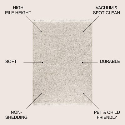 Cream 8' x 10' Reversible Shag Area Rug with Tassels