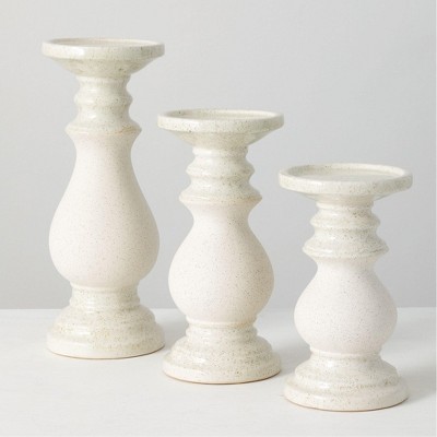 white candle pedestal