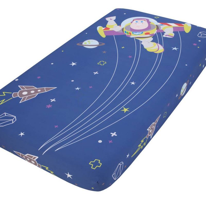Disney Baby Toy Story Buzz Lightyear Photo Op Fitted Crib Sheet - Blue and Green, 1 of 5