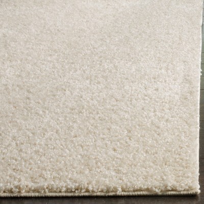 Cream 8' x 10' Tufted Shag Area Rug