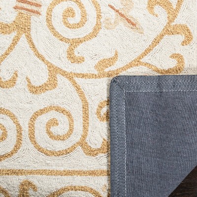 Ivory and Gold Hand-Hooked Wool Area Rug, 2' x 8'