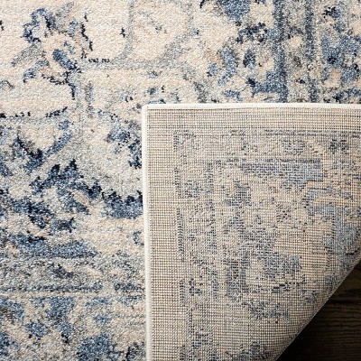 Ivory and Navy 8' x 10' Synthetic Oriental Area Rug