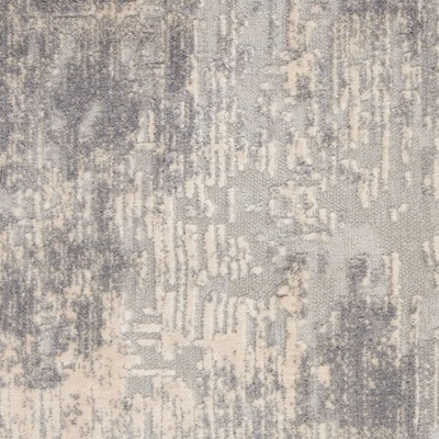 Ivory Abstract Power-Loomed Synthetic 5'3" x 7'3" Area Rug