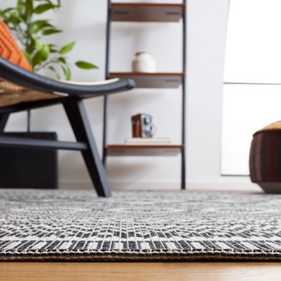 Augustine Black and Ivory Geometric Synthetic Area Rug, 6'4" x 9'6"