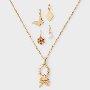 14K Gold Dipped Cubic Zirconia Bow Pendant Charm Necklace Set 5pc - A New Day™ Gold - 1 of 4