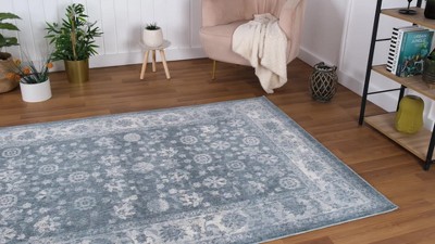Ivory and Blue Floral Synthetic 5' x 7' Area Rug
