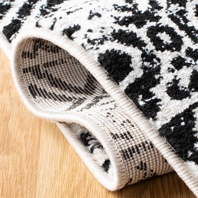 Ivory and Charcoal Geometric 9' x 12' Synthetic Area Rug
