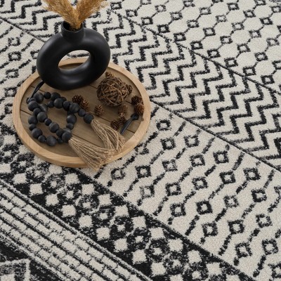 Constantin Black and Gray Bohemian Polypropylene Area Rug 6'7" x 9'