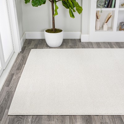 Cream Solid Synthetic Low-Pile Reversible Area Rug 8 x 10
