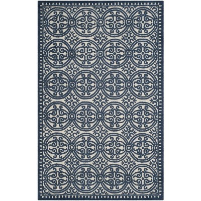 Ivory and Navy Geometric Wool 6' x 9' Handmade Tufted Rug