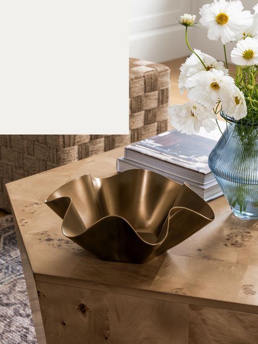 Gold ruffle bowl on coffee table