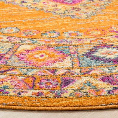 5'1" Round Orange and Fuchsia Synthetic Boho Chic Medallion Rug