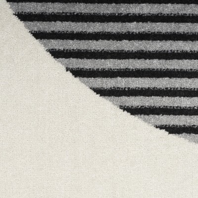 Ivory & Black Geometric Synthetic 6' x 9' Easy-Care Rug