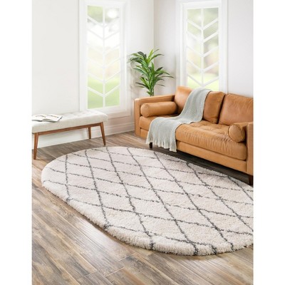 4' x 6' Oval Ivory Geometric Shag Synthetic Area Rug