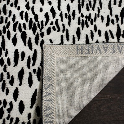 Ivory and Black Handwoven Wool and Synthetic Area Rug, 5' x 8'