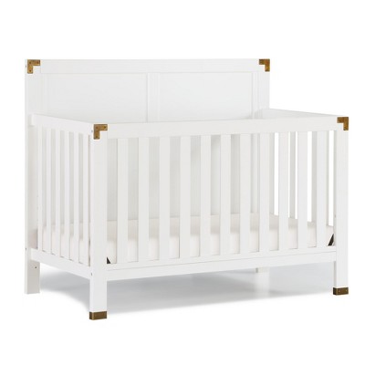 white crib with gold accents