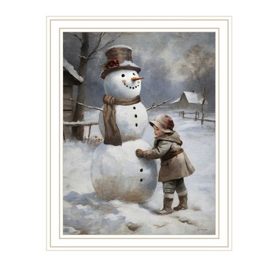 HomeRoots Boy Building A Snowman White Framed Wall Art
