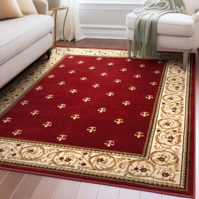 Fleur de Lis Red Synthetic 5'3" x 7' Area Rug