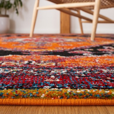 Vintage Orange and Black Synthetic 4' x 6' Area Rug