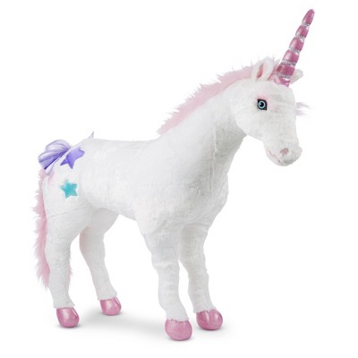 giant pink stuffed unicorn