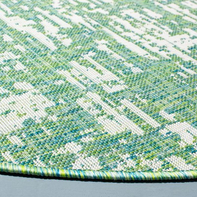 Ivory Elegance 79" Round Synthetic Indoor/Outdoor Area Rug