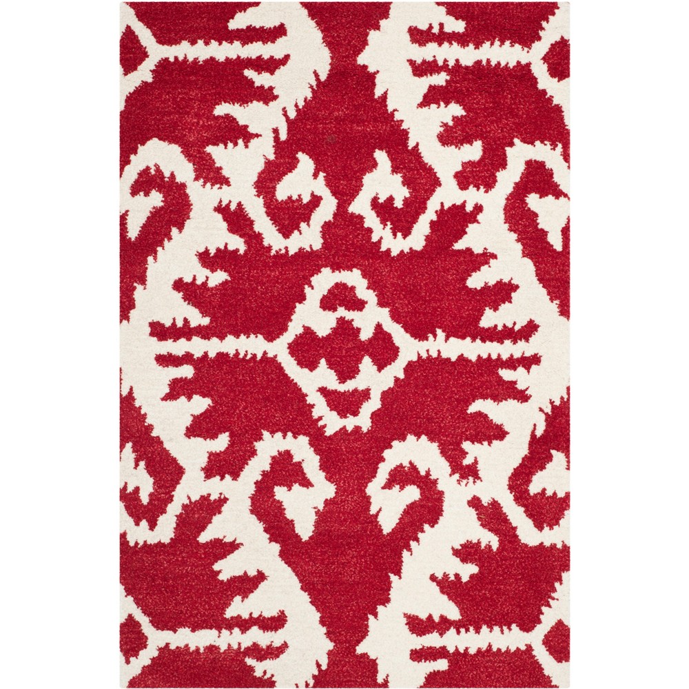2'6inx4' Geometric Design Tufted Accent Rug Red/Ivory - Safavieh
