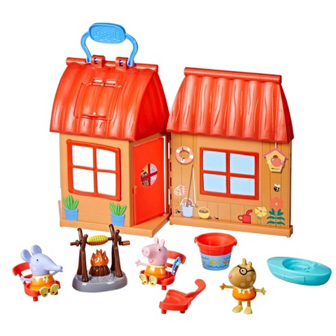 A plastic Peppa Pig toy play house standing on a table Stock Photo