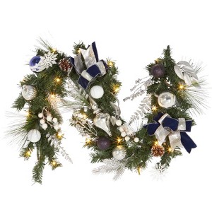 6-foot pre-lit Christmas wreath adorned with pine cones, berries, poinsettias, bows, and spherical ornaments, with 20 warm white lights. - 1 of 4
