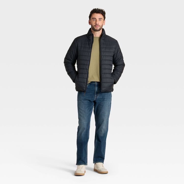 Black colored quilted jacket with a high collar and front zipper.