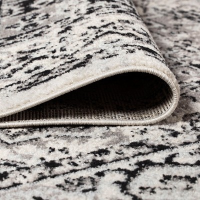 4' x 6' Dark Gray and Cream Medallion Synthetic Area Rug