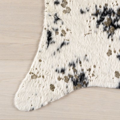 Black and White Tufted Synthetic Cowhide Accent Rug