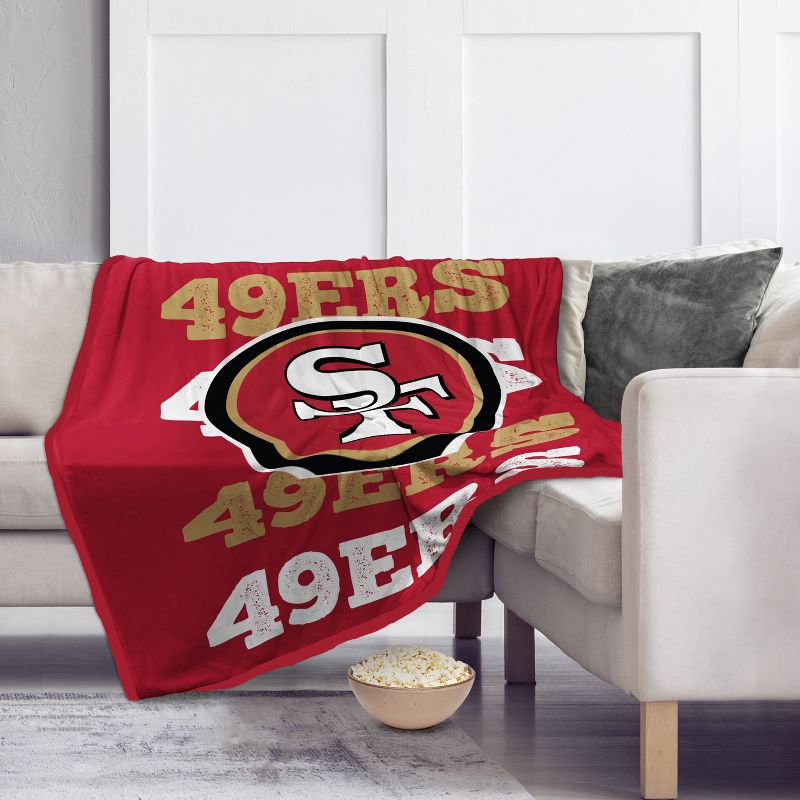 NFL San Francisco 49ers Repeat Refresh Wordmark Flannel Fleece Throw Blanket, 1 of 4