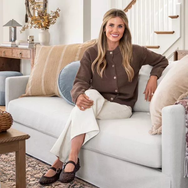 Shea McGee sitting in living room