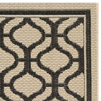 Cream and Black Geometric 8' x 10' Synthetic Rug