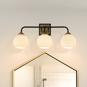 ALOADECOR 3-Light W22" Modern Elegant Brass And Black Bathrooom Vanity Light with Round Milk White Glass Shades - 1 of 4