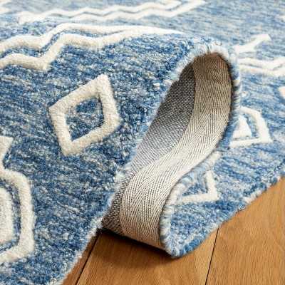 Handmade Blue and Ivory Tufted Wool Round Rug