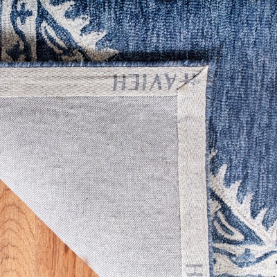 Blue and Ivory Tufted Wool 4' x 6' Area Rug