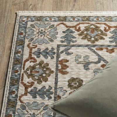 Hastings Ivory and Green Synthetic Rectangular Area Rug 5'3" x 7'6"