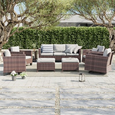 Sonkuki 8-Piece Patio Conversation Set, Outdoor Furniture Set with 4 Rattan Swivel Rocking Chairs, Side Table, Ottoman and Navy Blue Cushion