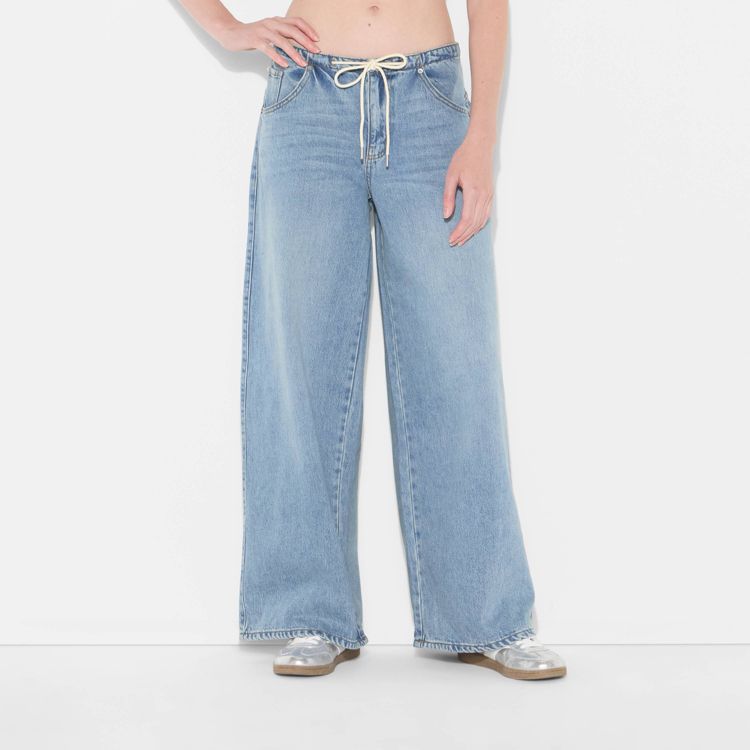 Light blue colored wide-leg jeans with a drawstring waist.