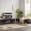 63-inch Mid-Temperature Modern TV Stand | Slatted Grille Doors with Storage Ideal for Living Room, Bedroom, and Entertainment Center - 2 of 4