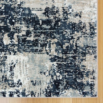 Ivory and Navy Abstract 5' x 7' Synthetic Area Rug