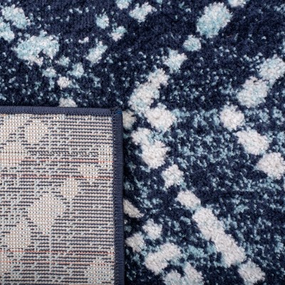 Navy and Ivory Geometric 4' x 6' Synthetic Area Rug